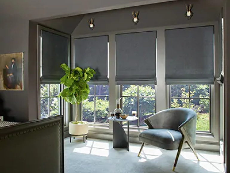 the-shade-store-flat-roman-shades-wool-sateen-grey-modern-window-treatments-dark-bedroom-content-2020-chappaqua-400x330-1.jpg